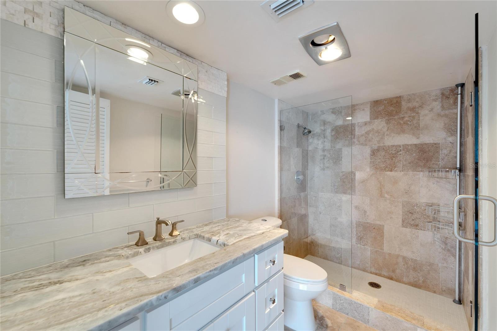REMODELED PRIMARY BATH WITH TRAVERTINE