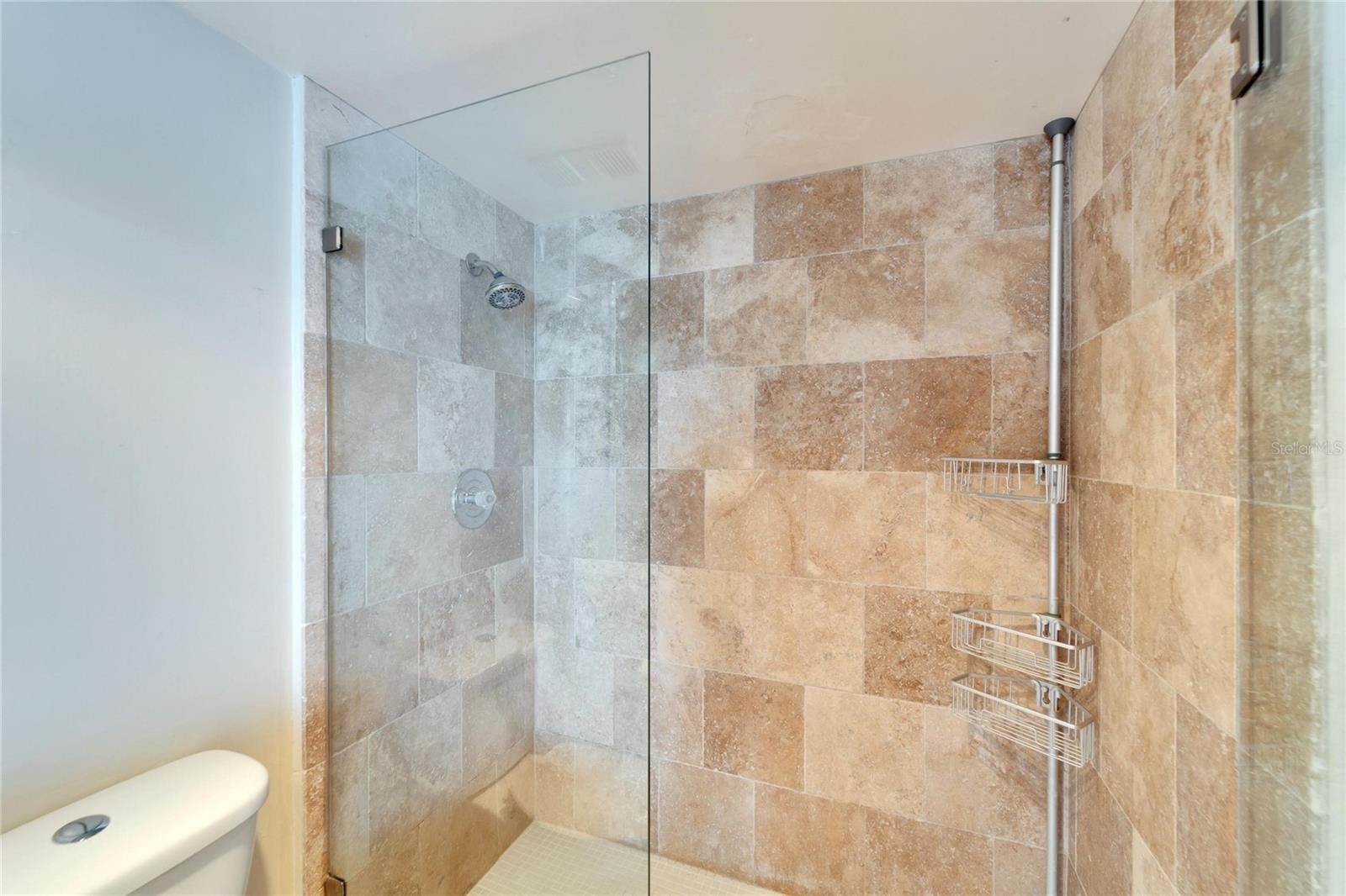 REMODELED PRIMARY BATH WITH TRAVERTINE