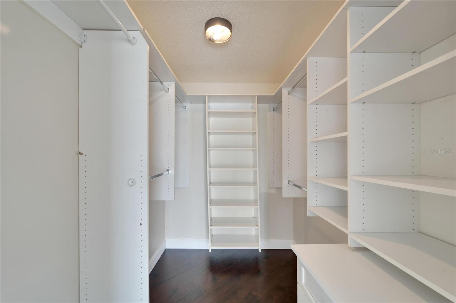 PRIMARY BEDROOM CLOSET WITH GREAT STORAGE AND SHELVING