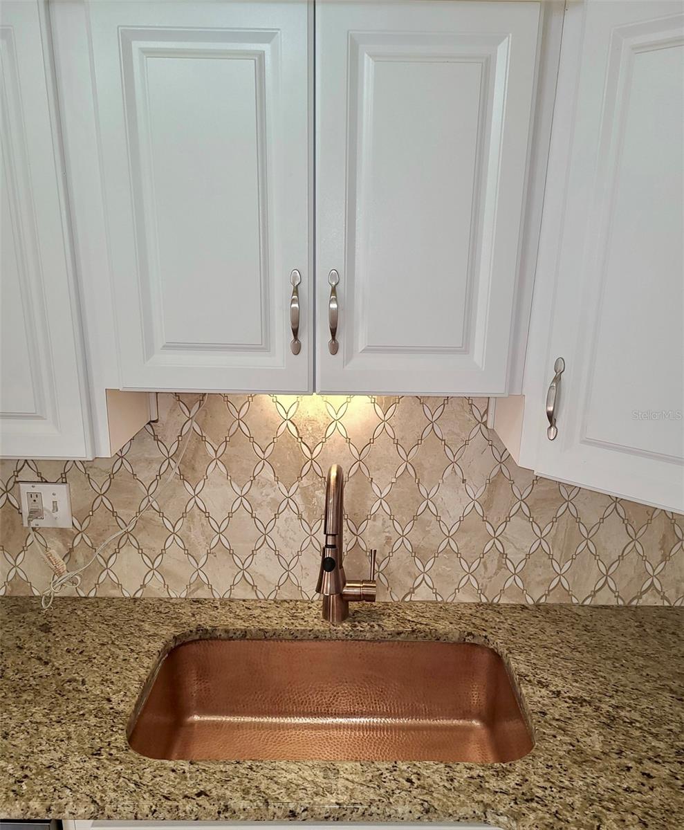 Beautiful new hammered copper undermount sink and new fixture