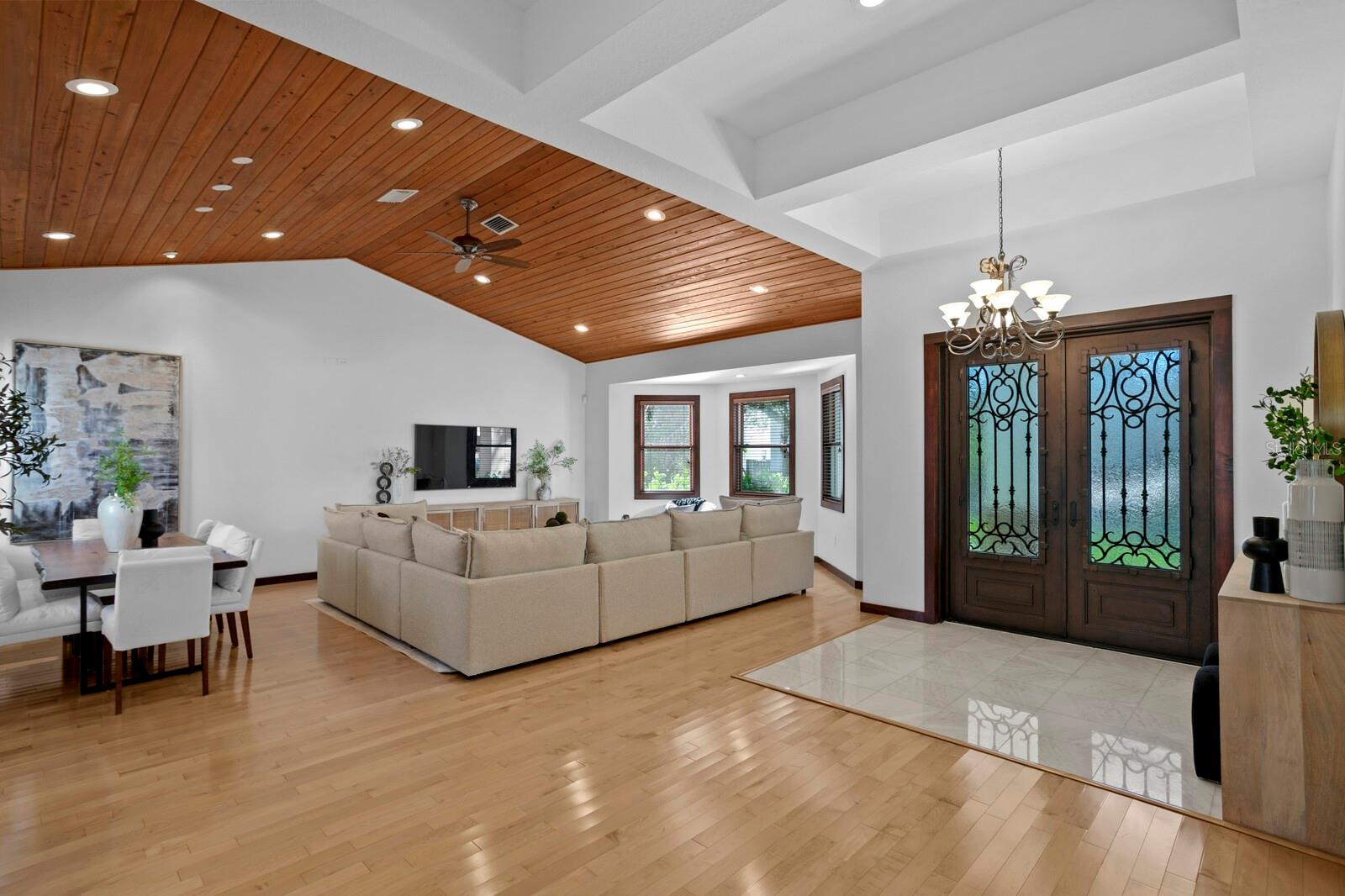 The spacious foyer opens to the living and dining rooms