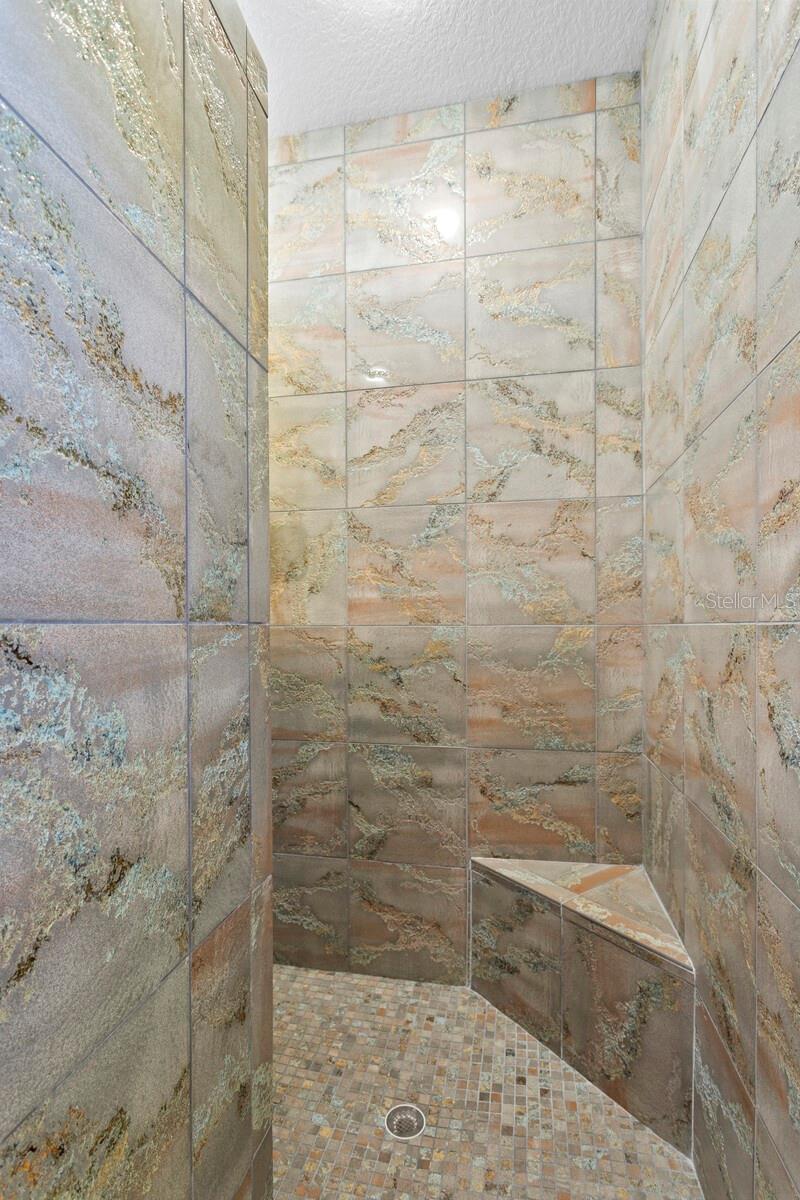 Walk-in shower with multiple shower heads