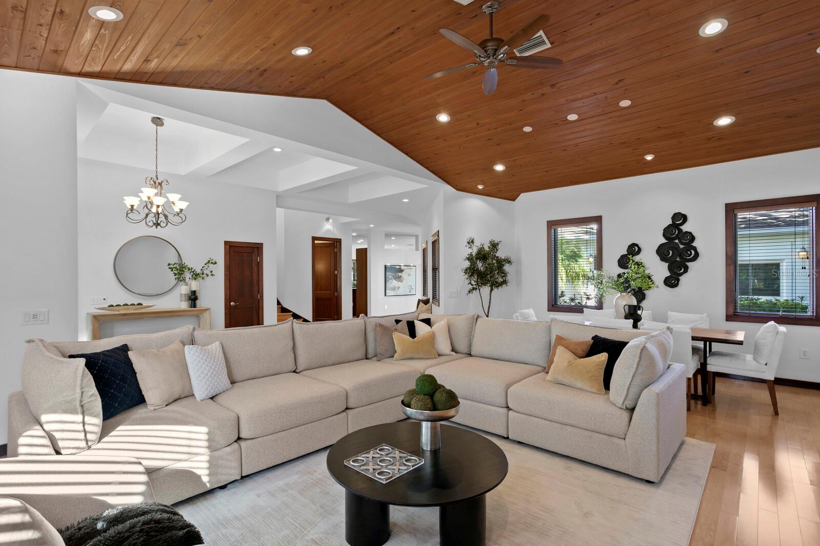 There are decorative wood ceilings in the living and dining rooms