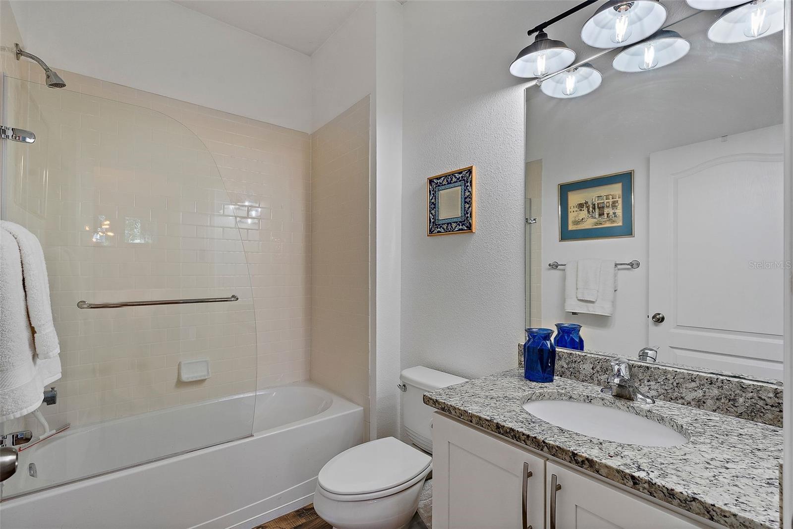 Lower level full bathroom with tub/shower combination.