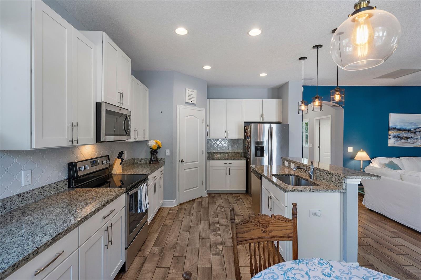 Kitchen has all the modern conveniences, plus an ideal open floor plan and center island.
