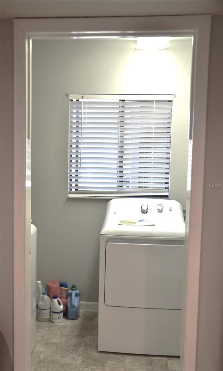 Utility room off kitchen for ease of laundry