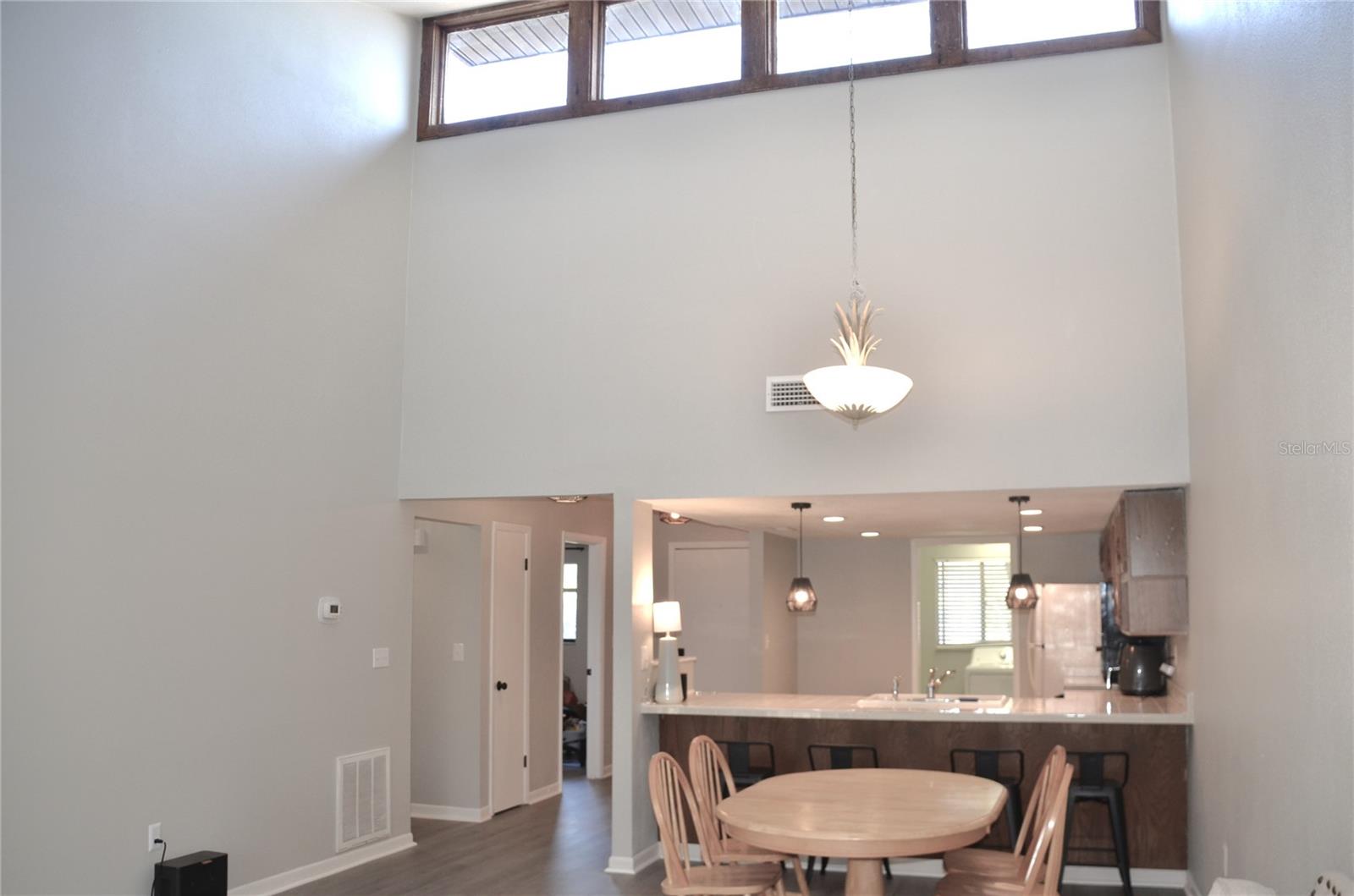 Transom windows in vaulted ceiling allows natural light