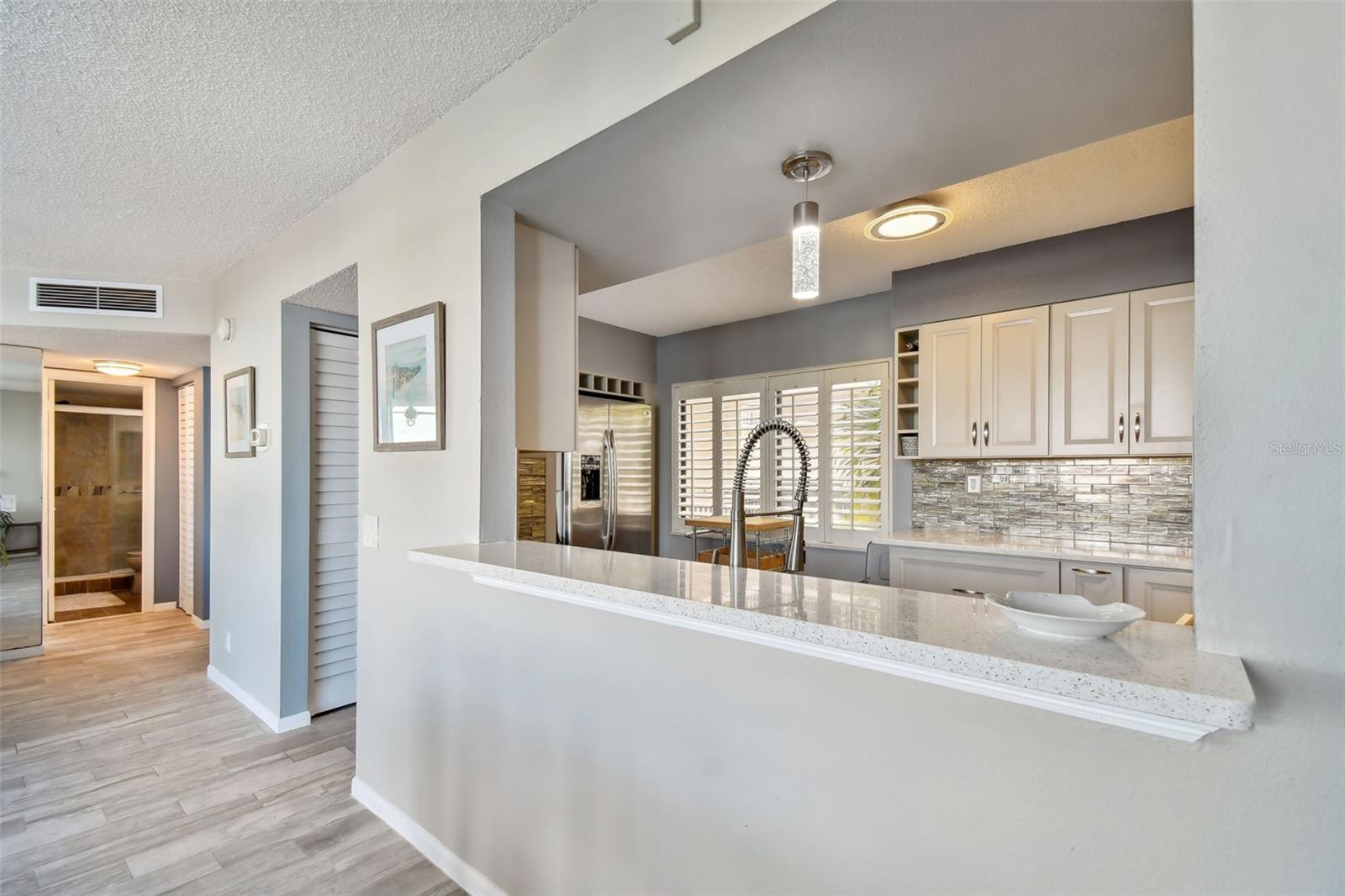 Newly remodeled kitchen features all the modern convenience including stainless steel appliances throughout