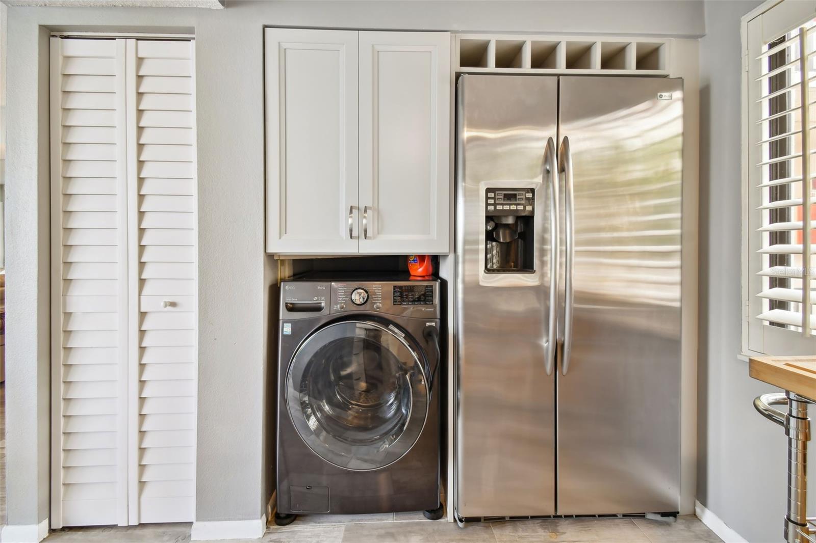 Washer/dryer is conveniently located in the kitchen