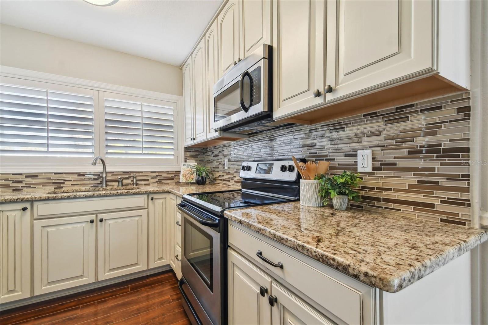 Kitchen with Granite countertops & Custom Cabinetry