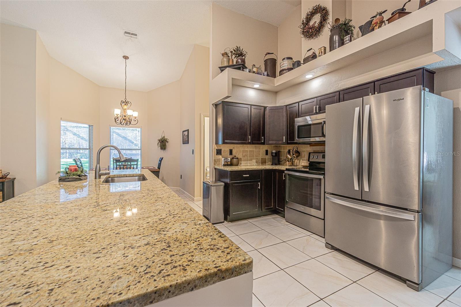 Beautiful wood cabinets, large granite topped island, and all stainless appliances new in 2019