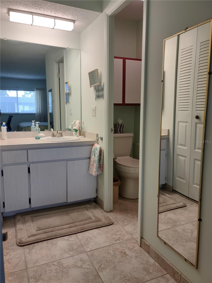 Vanity area is separate from private shower & commode room.