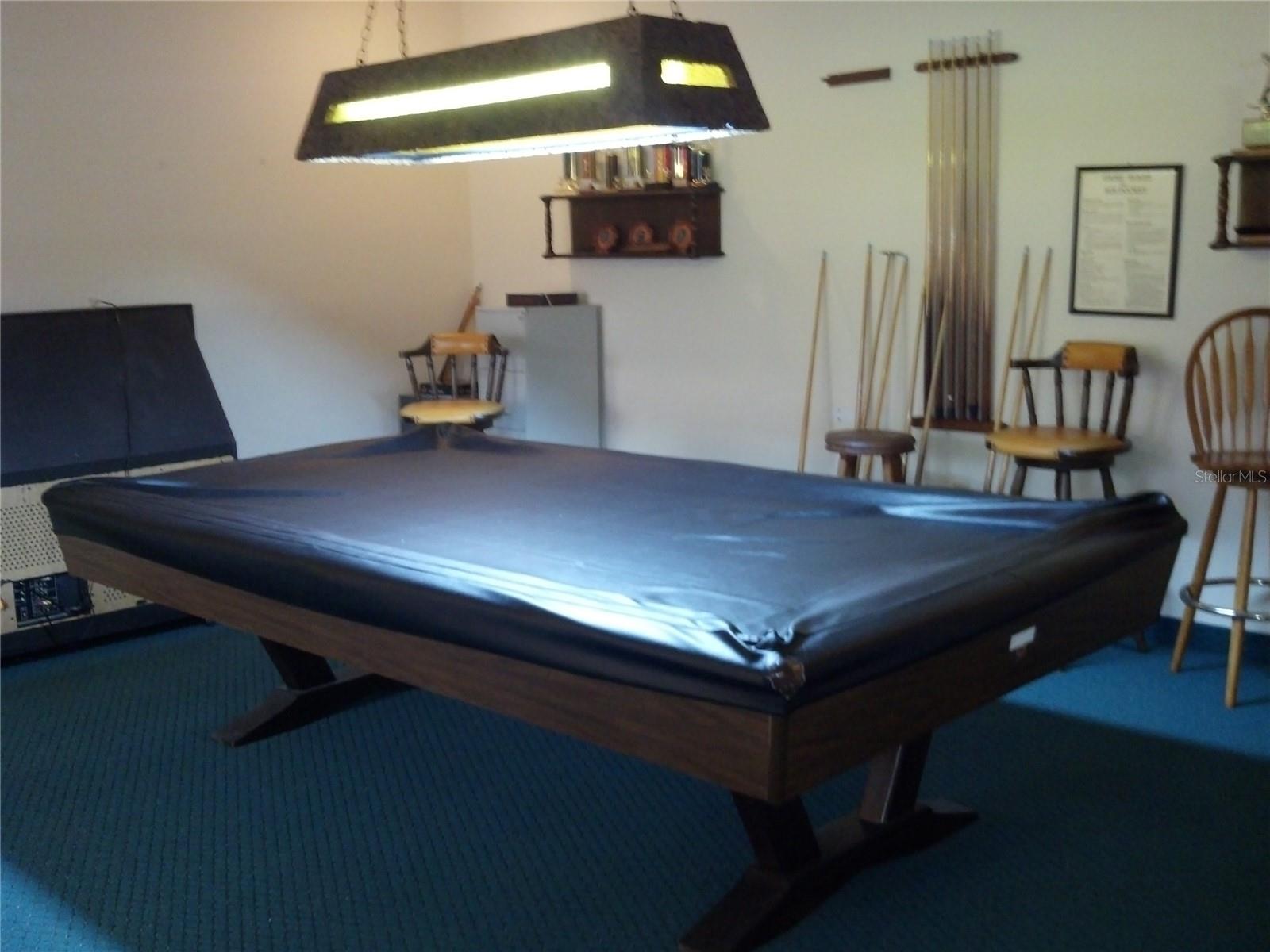Pool table in game room.