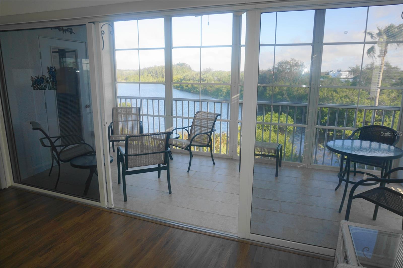 The lanai is enclosed with vinyl windows to keep the rain out & let the breezes in.