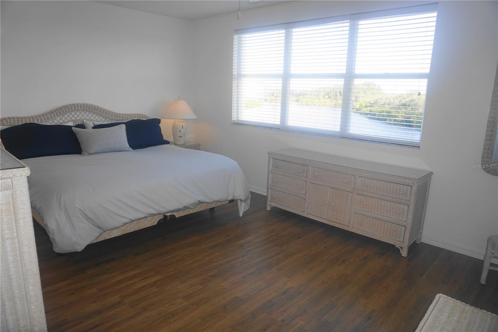 The large primary bedroom also offers great water views!