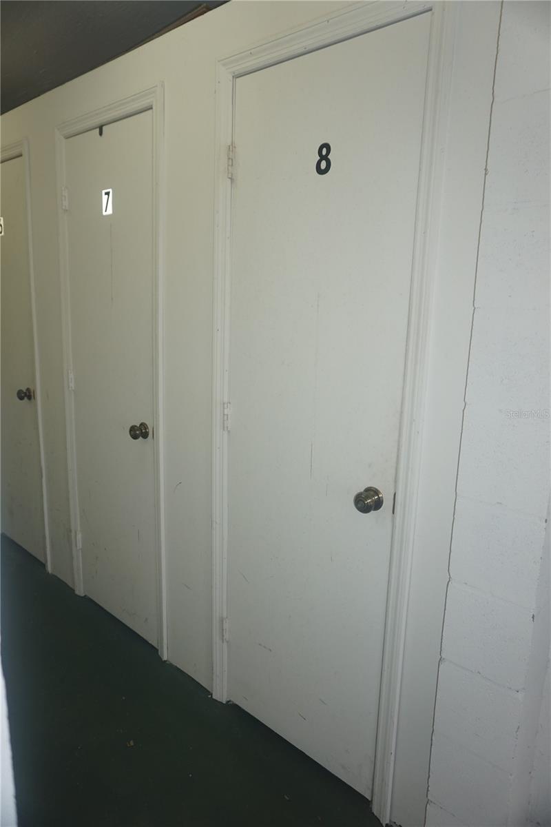 The storage area is on the same floor (next to the elevator)