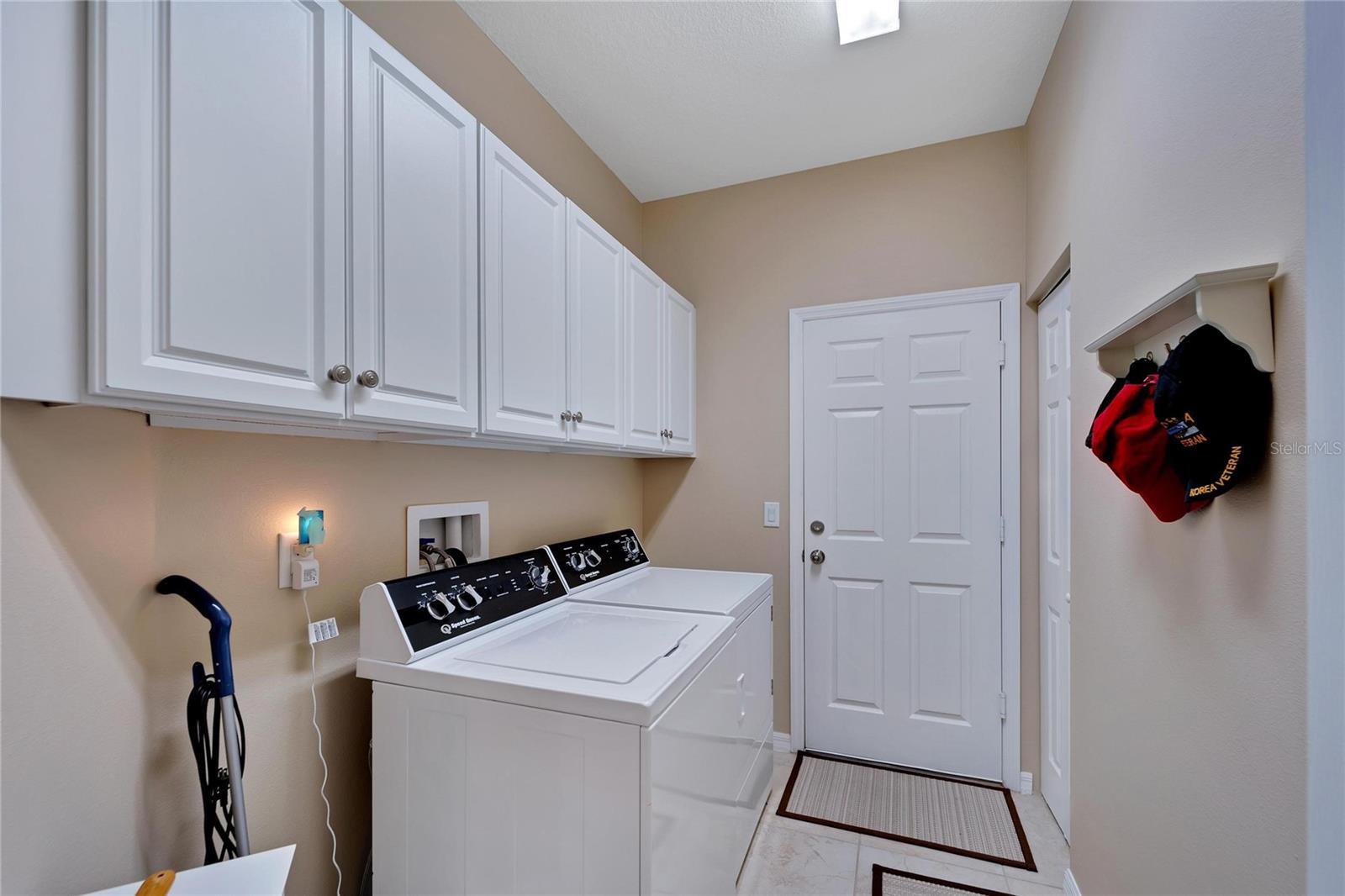 Interior Laundry Room with Wash Tub & Cabinets