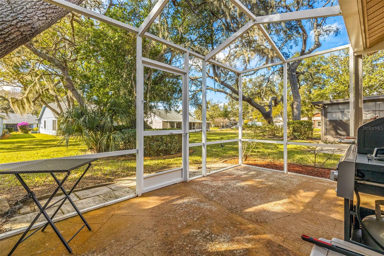 Separate Screened in lanai!  Great for your BBQ or enjoying the perfect Florida weather!