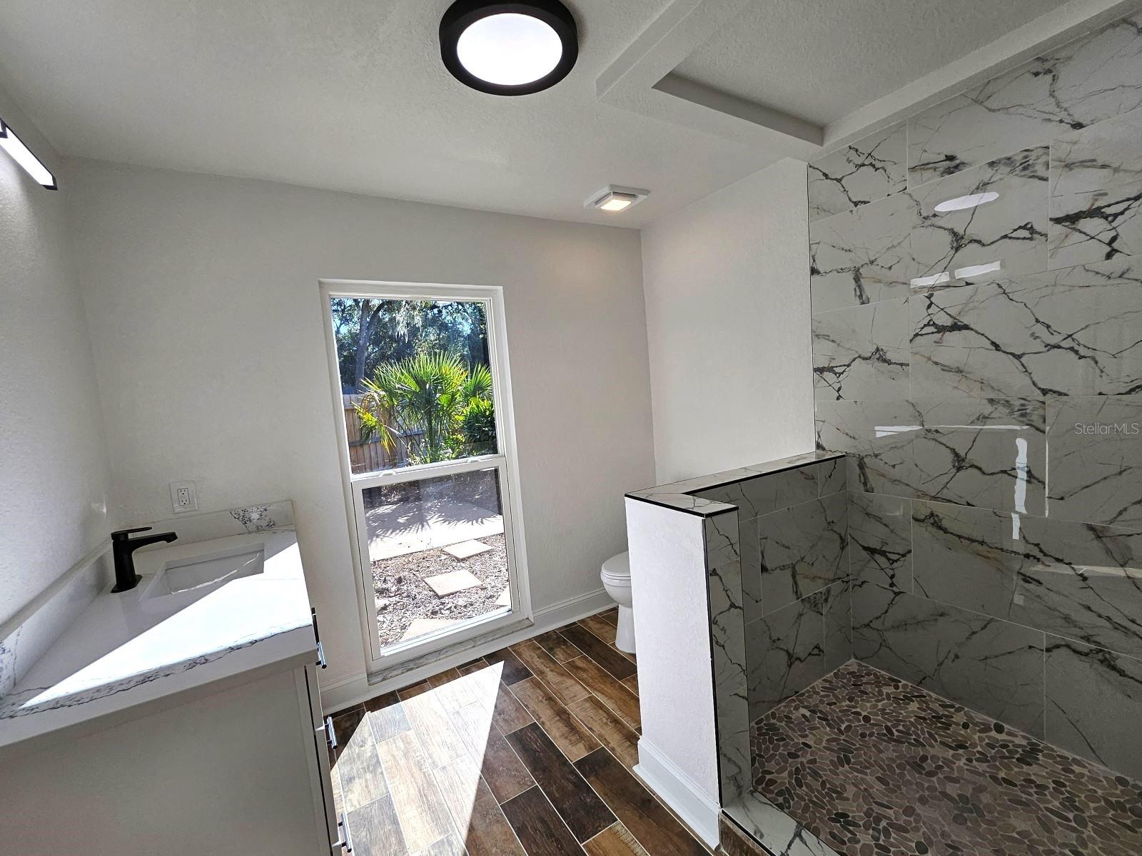 2nd Master Bath with walk in closet and view of zen garden