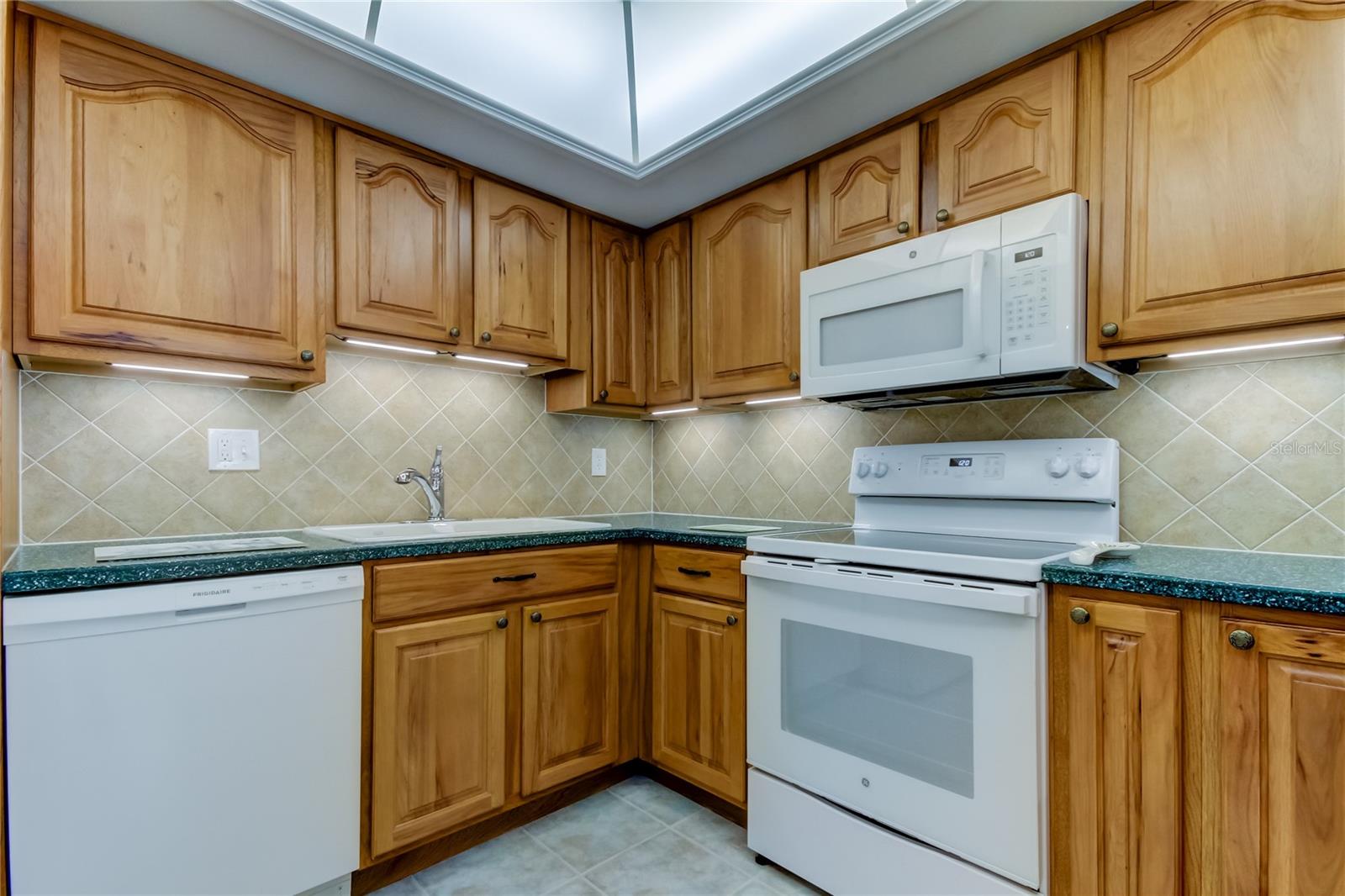 Tasteful Solid Maple Wood Cabinetry & Newer White Appliances in Kitchen!