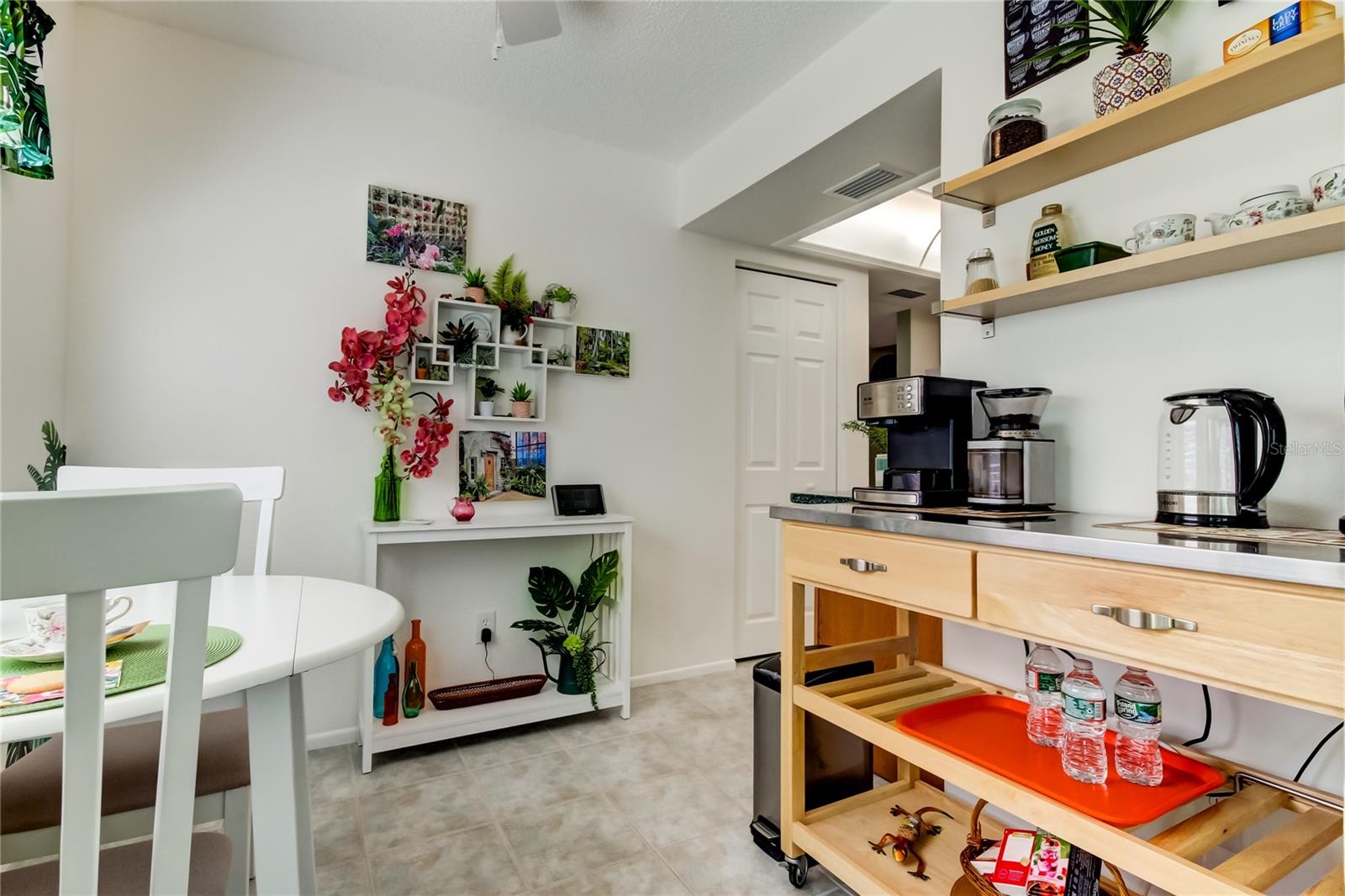 Beautiful Built In Shelving Compliments the Kitchen Cabinetry.. Creating a Convenient Coffee or Tea Bar too!