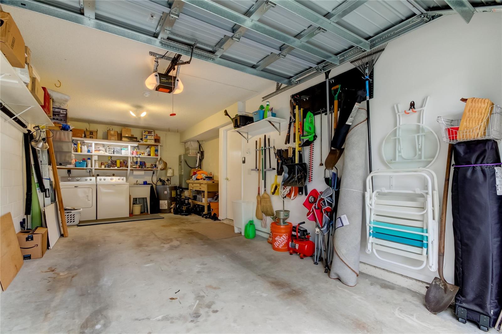 Oversized Garage (10.7' x 24.6')  is Neatly Organized.. Hopefully You Can Keep it That Way, lol!