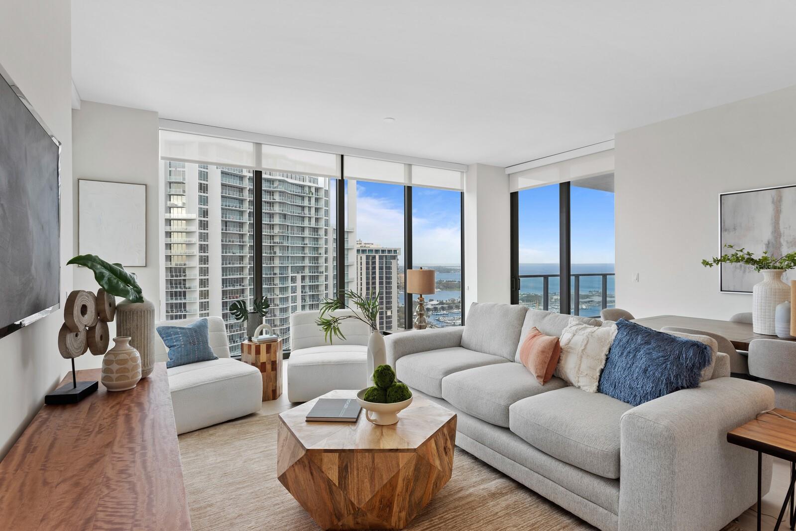 Gorgeous living area with floor to ceiling views of downtown, Tampa Bay and surrounding