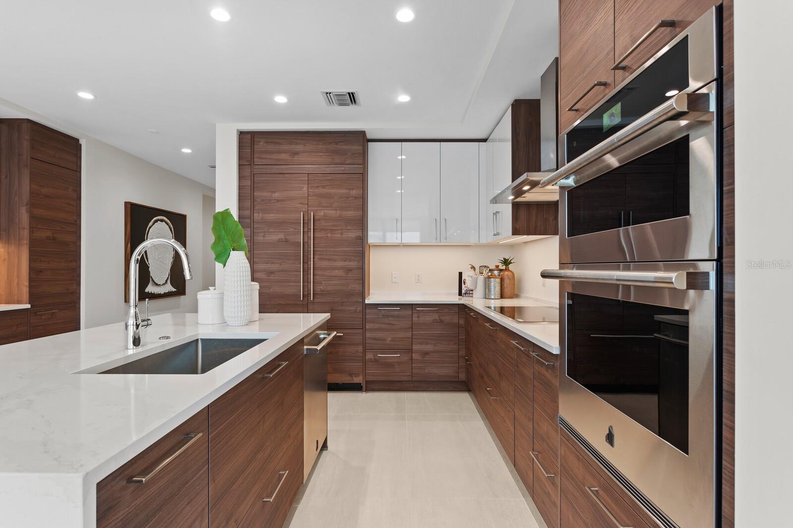 Stunning kitchen with adjacent bar and additional storage