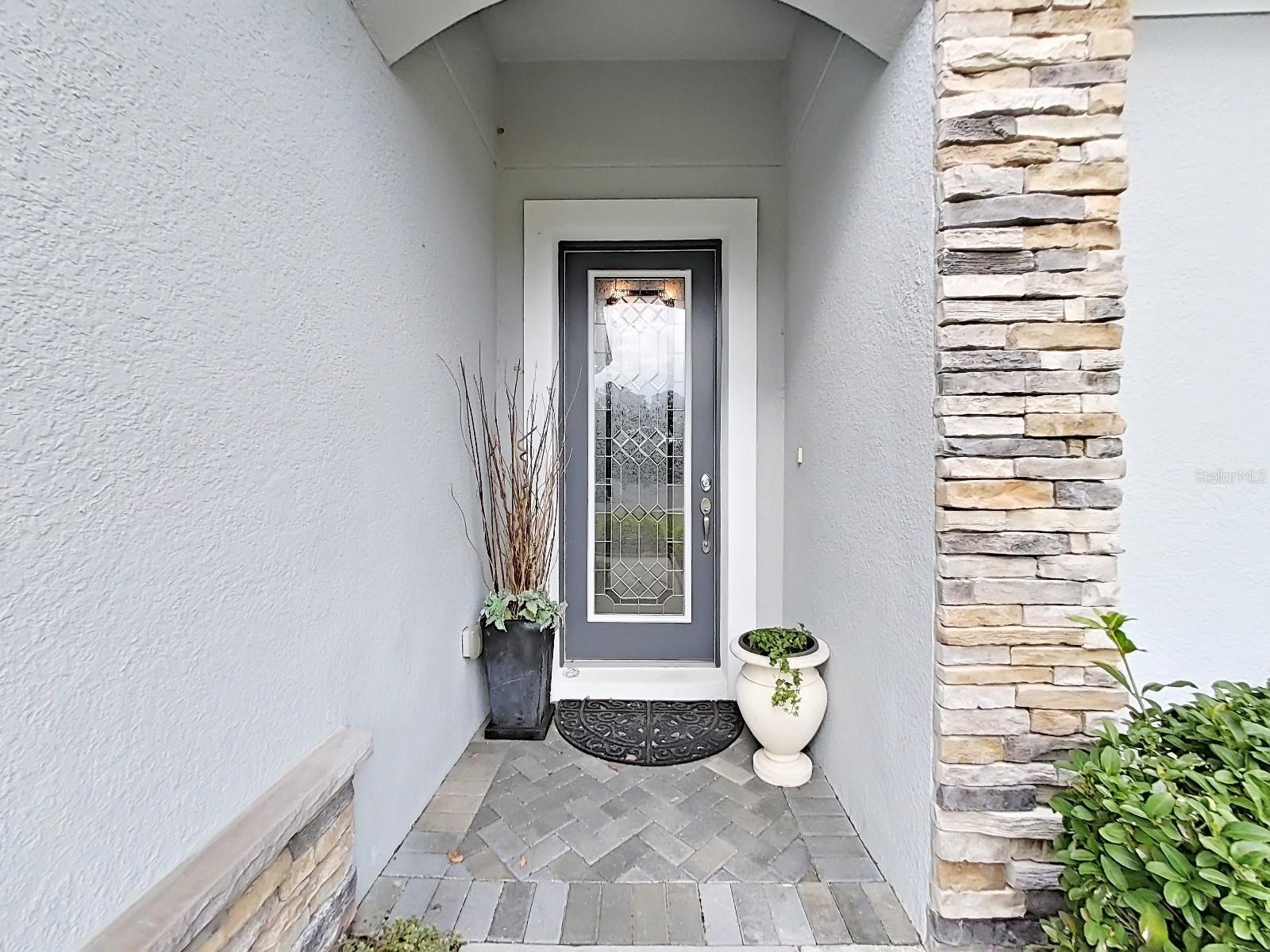 Flagstone Accent, Slate Floor Tile & Leaded Glass Door = Welcoming Entry