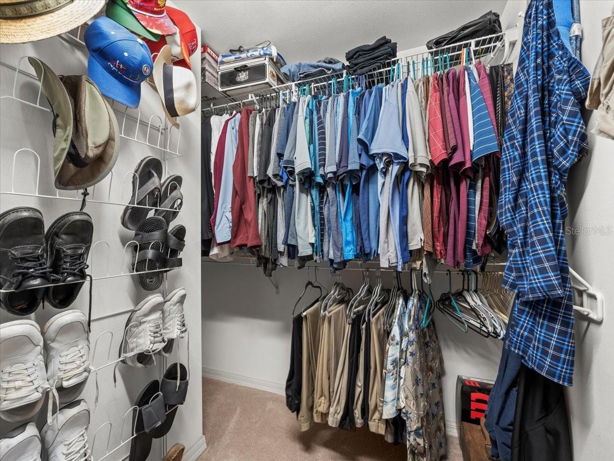 Closet on the right side of the hallway when facing the bathroom