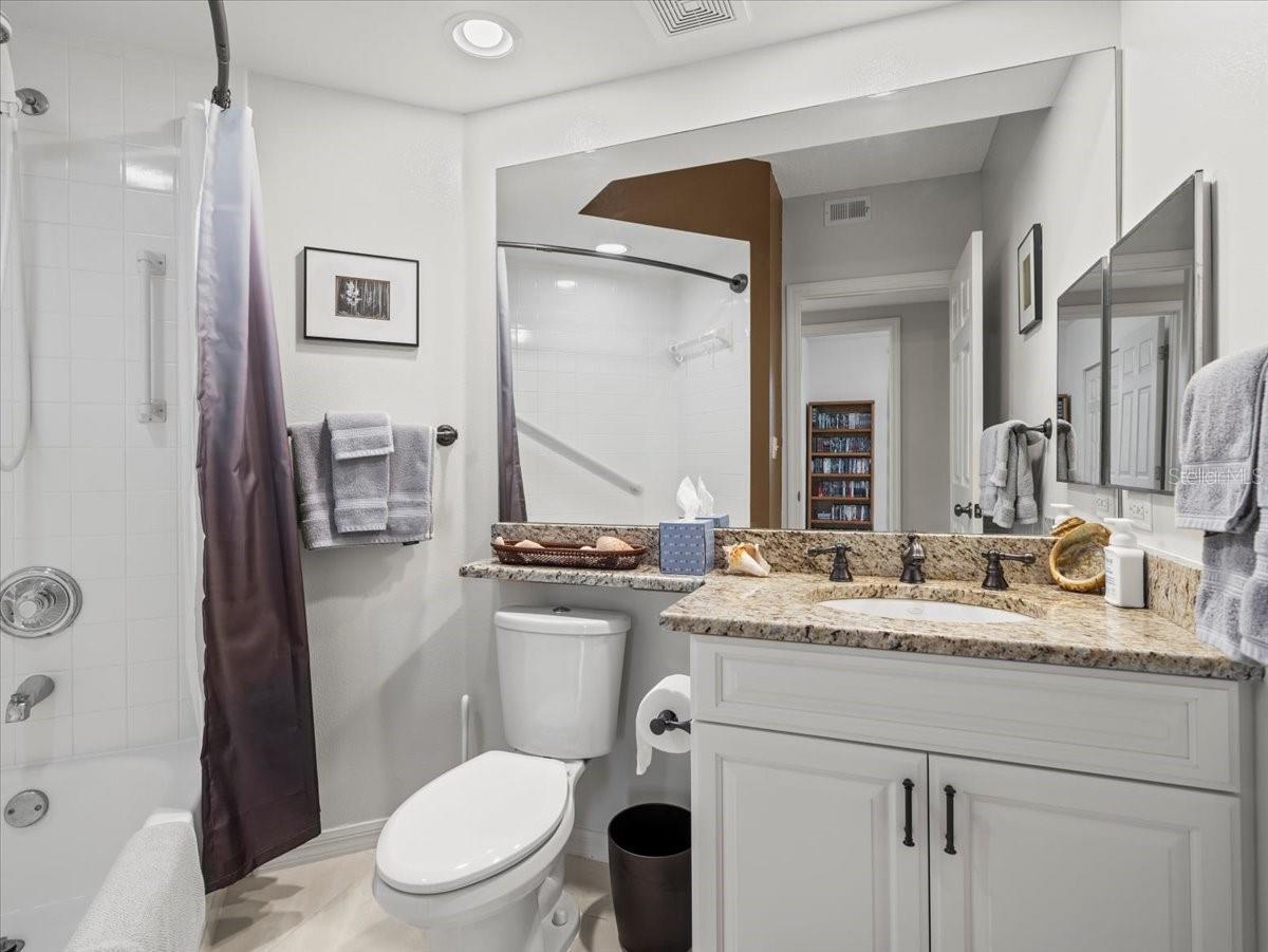 Guest bathroom in the wing with the two guest bedrooms.  The bathroom is outfitted with a shower/tub combo.