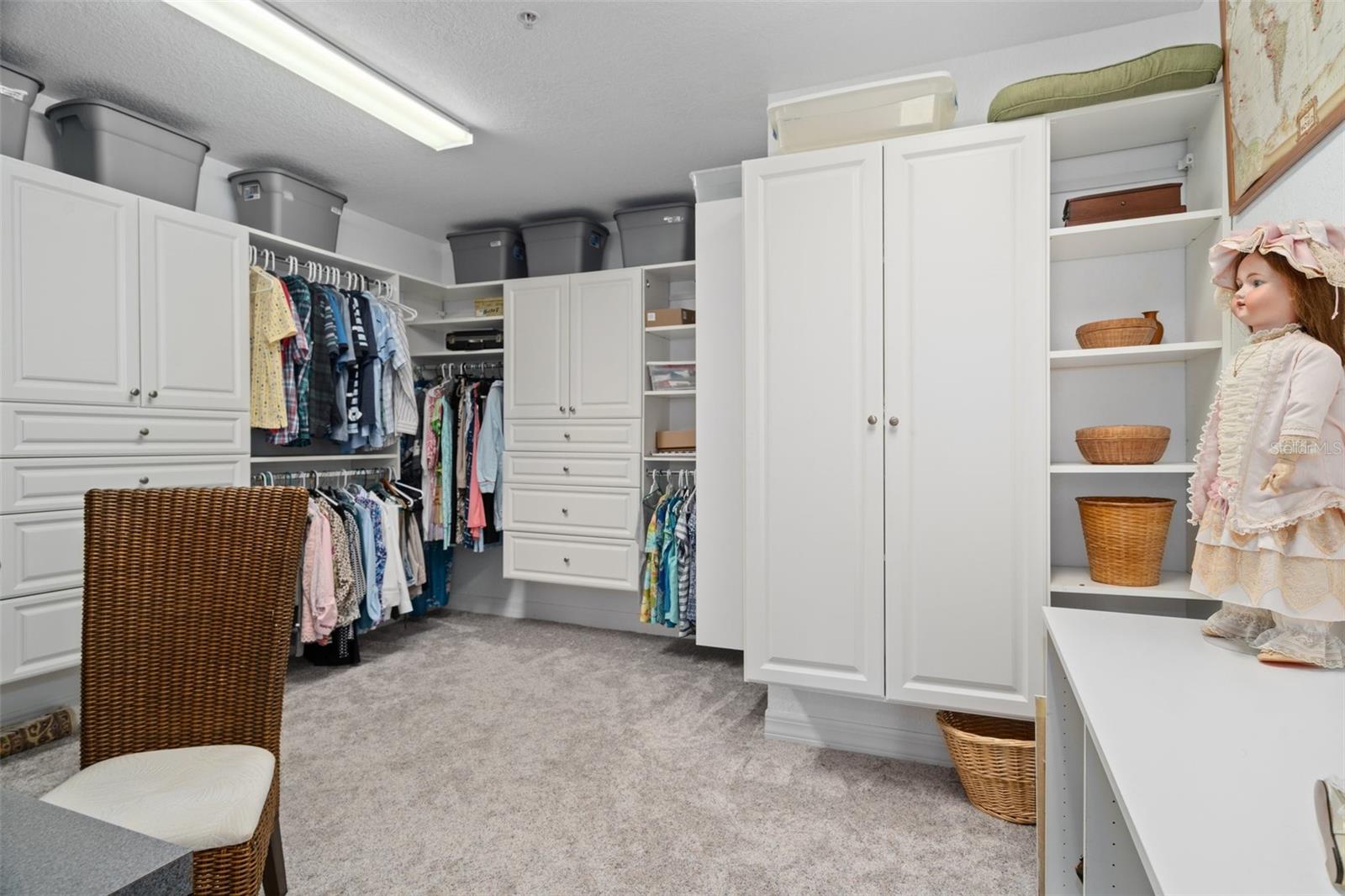 Master suite  walk in closet with custom cloest system
