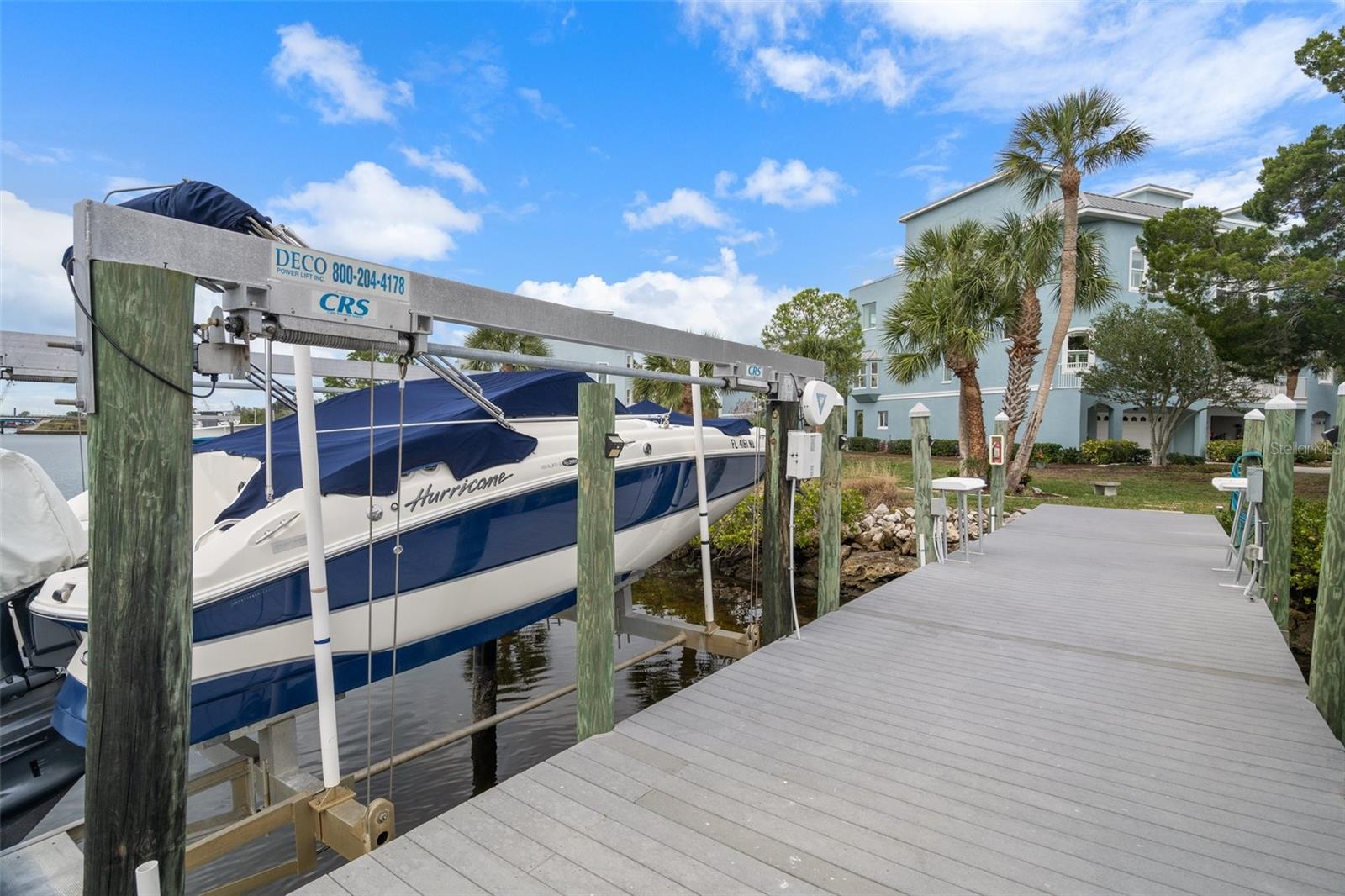 Boat dock/lift with water, electric and fish cleaning station. BOAT NEGOTIABLE