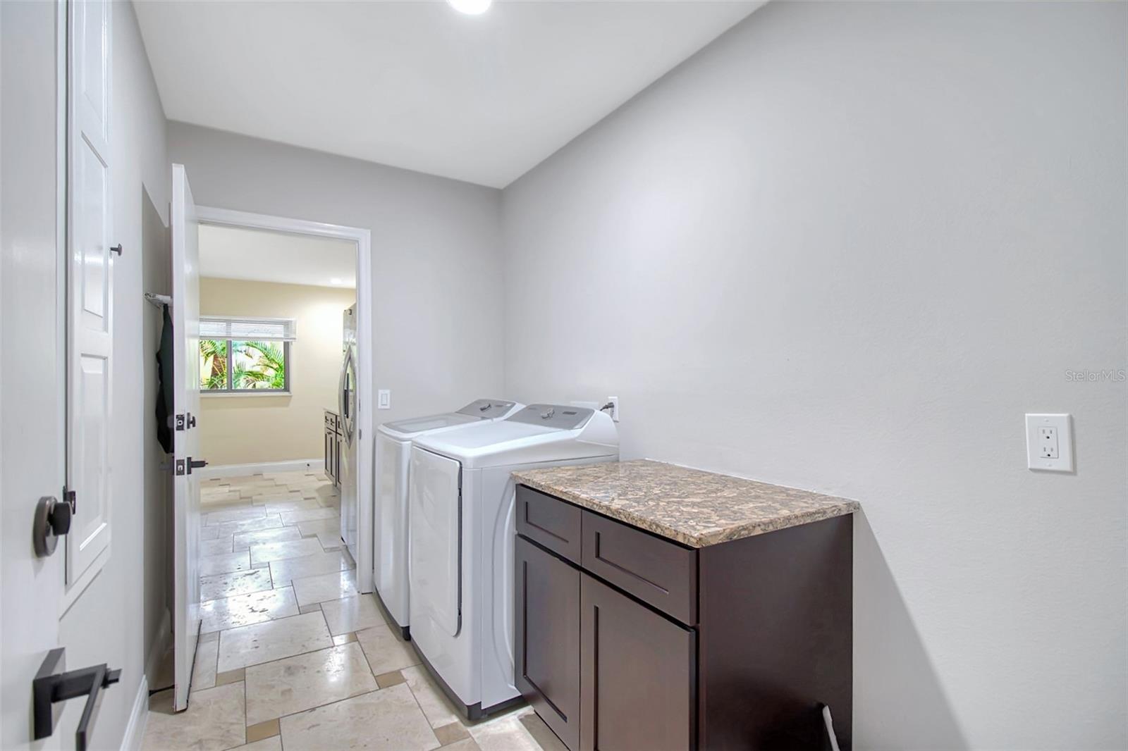 Laundry room leading to self contained In Law apartment/teen suite/guest suite/Primary bedroom 2/rental apartment