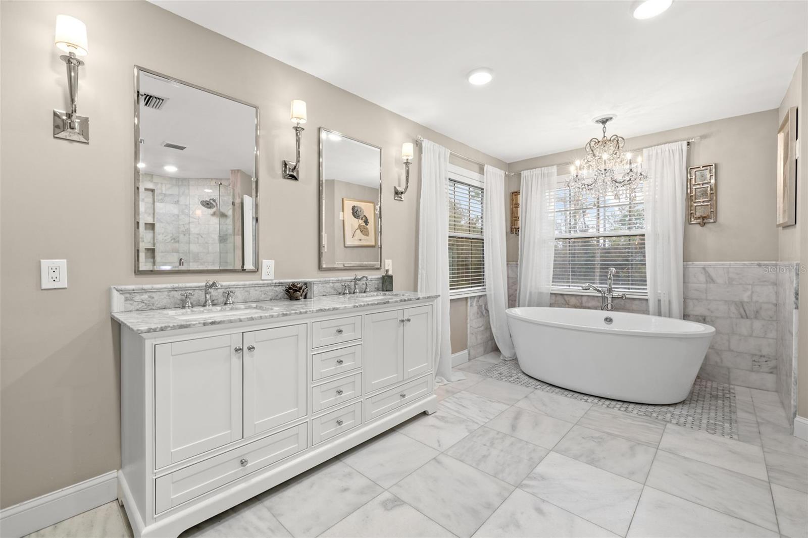Renovated Primary Bathroom with marble throughout