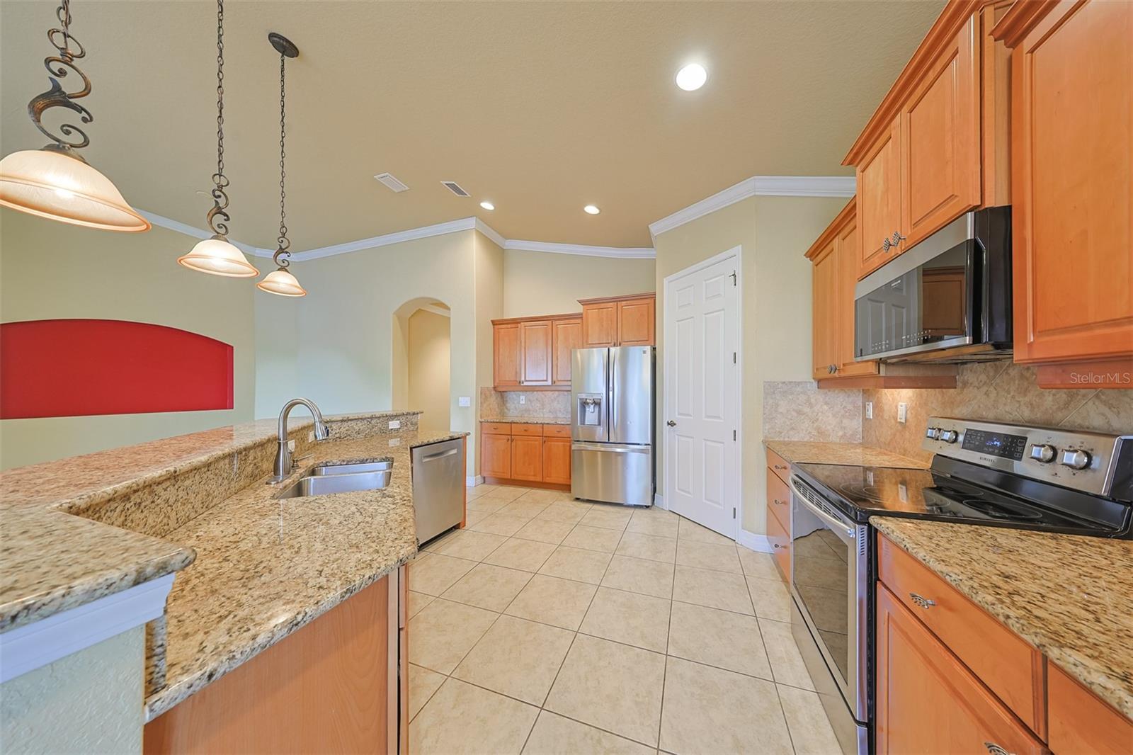 Lots of granite countertops for any task and newer stainless-steel appliances.