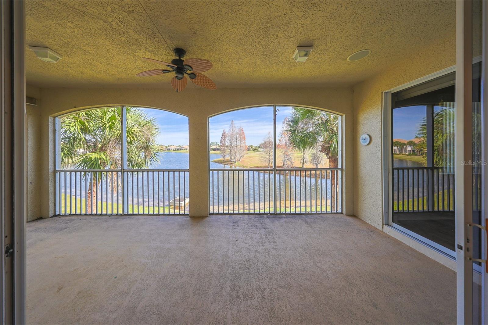What a view!!  You are among the treetops!  Beautifully spacious screened lanai with ceiling fan for enjoying all year-round.