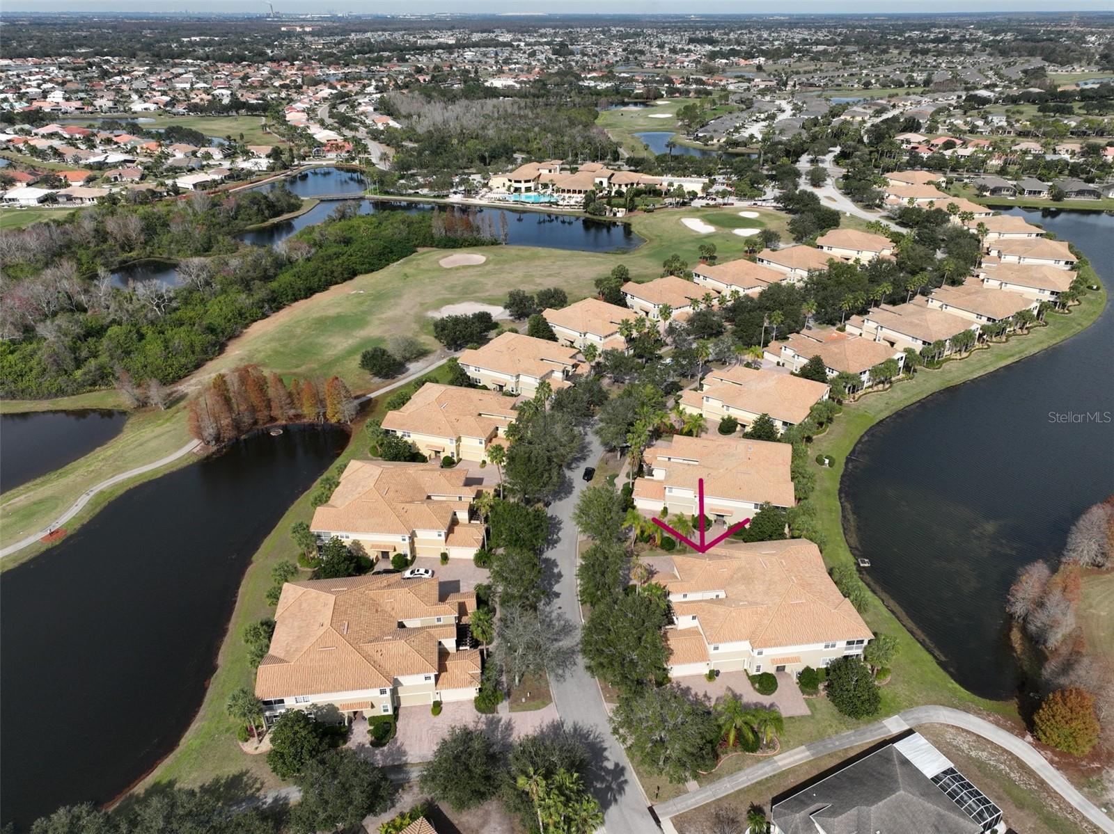 Aerial water view of condo.