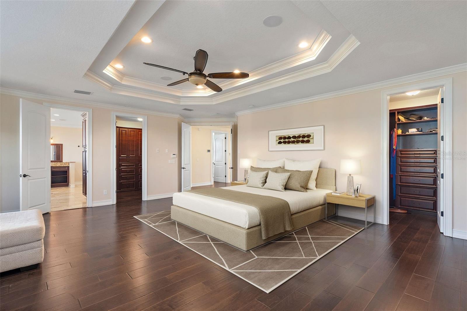 Virtually staged primary with tray ceilings