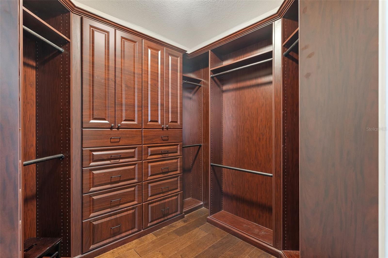 One of two primary walk in closets