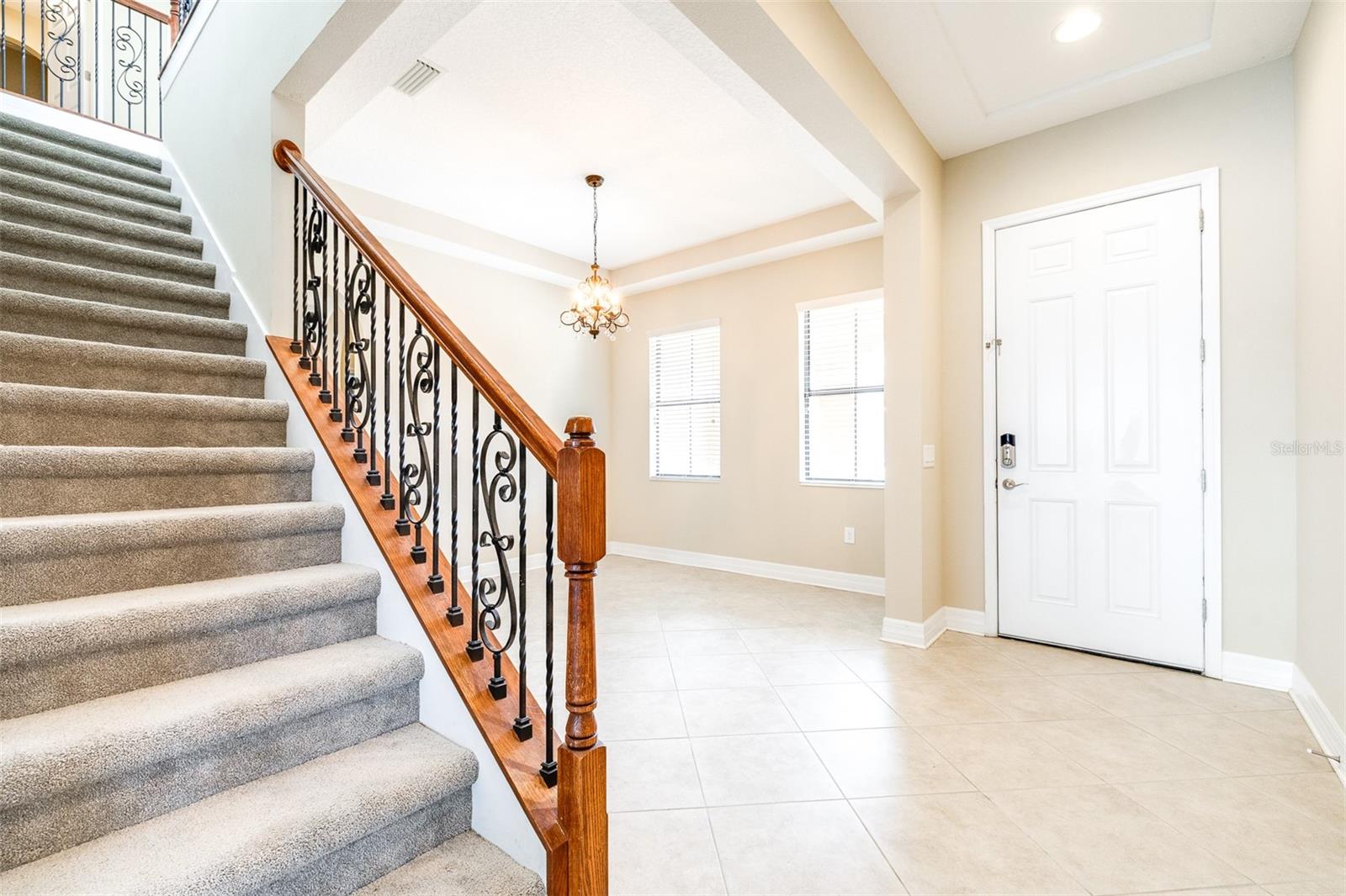 Foyer with beautiful view of upgraded staircase