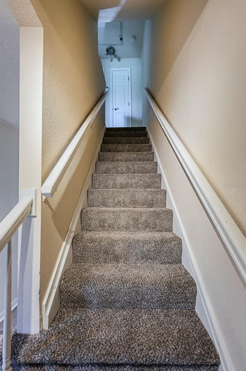 up the stairs to both bedrooms, 1 full bath & storage closet
