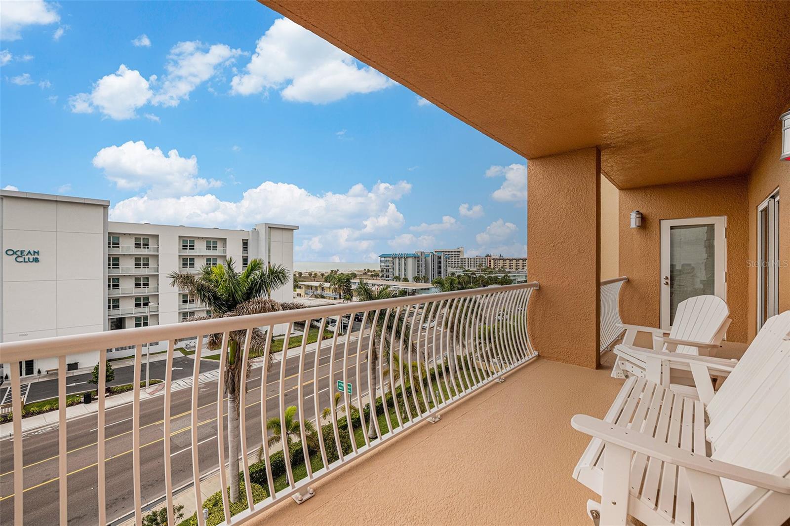 Enjoy Florida sunsets from the shared patio for Bedroom #2 and Bedroom #3.  Partial views of the beach are easily seen.