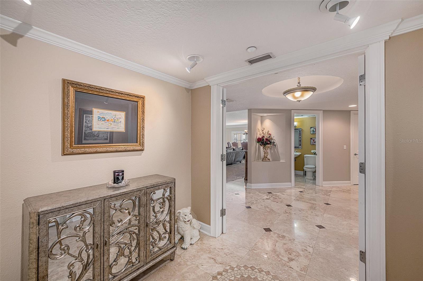 Private foyer with double door entry escorts you into a huge luxury condo with deeded boat slip, partial views of the Gulf of Mexico and intracoastal saltwater canal.