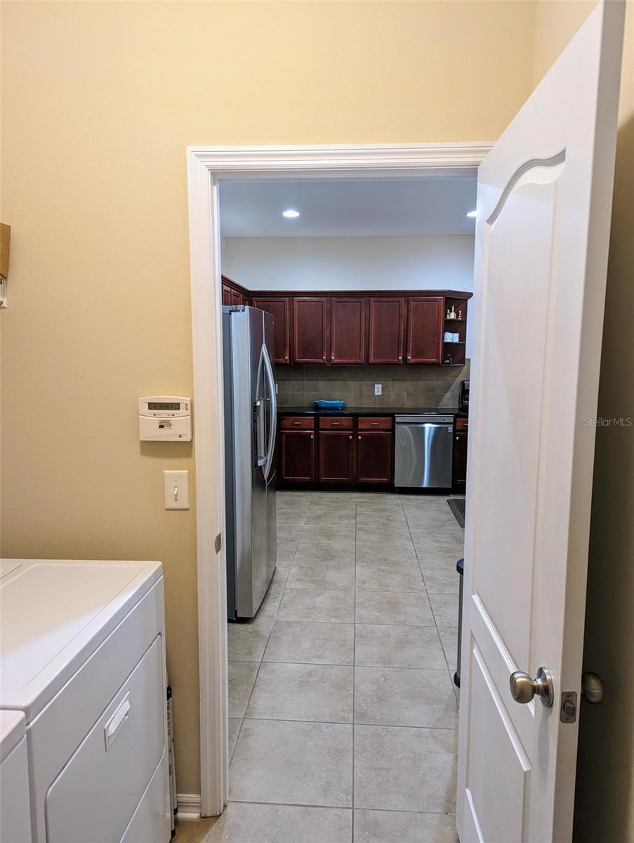 Laundry room connects Garage to Kitchen