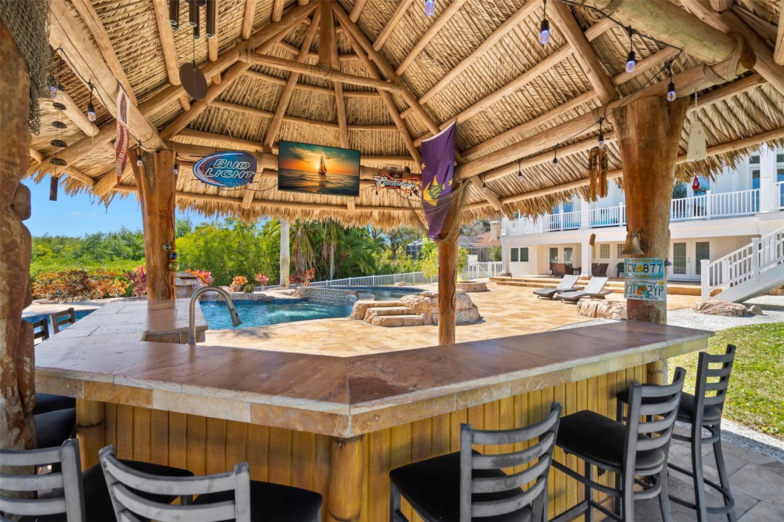 The tiki bar is a great place to host your guests for a game and pool party.