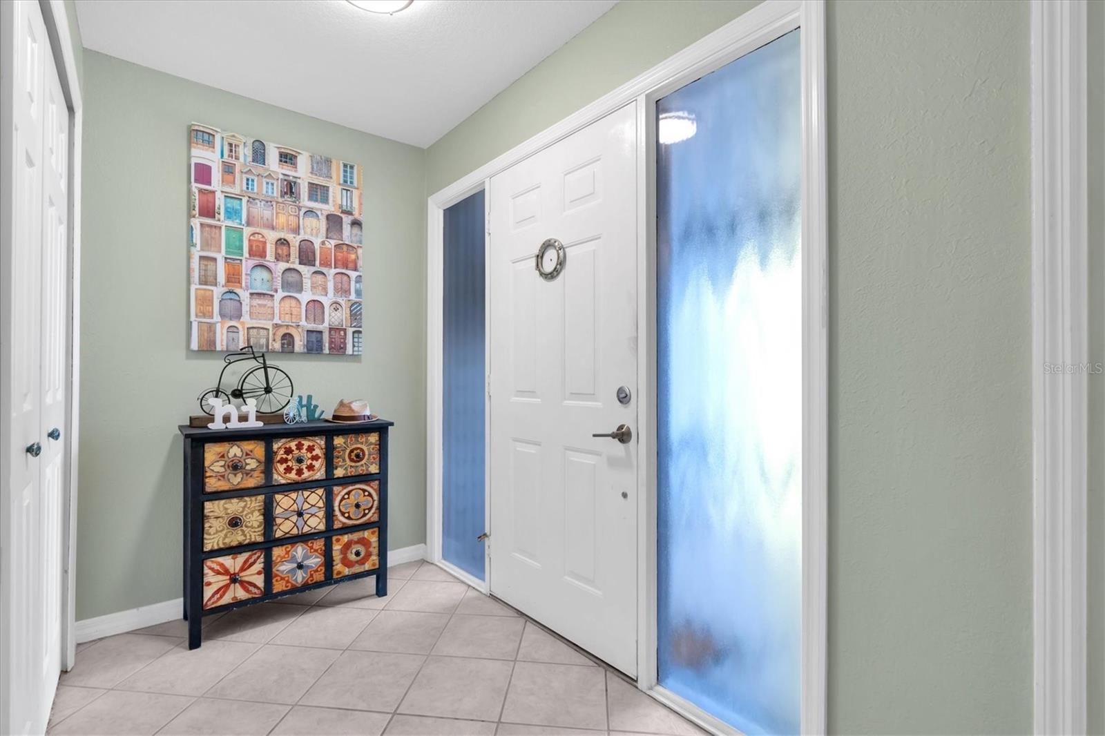 Entrance area with plenty of natural light and closet space.
