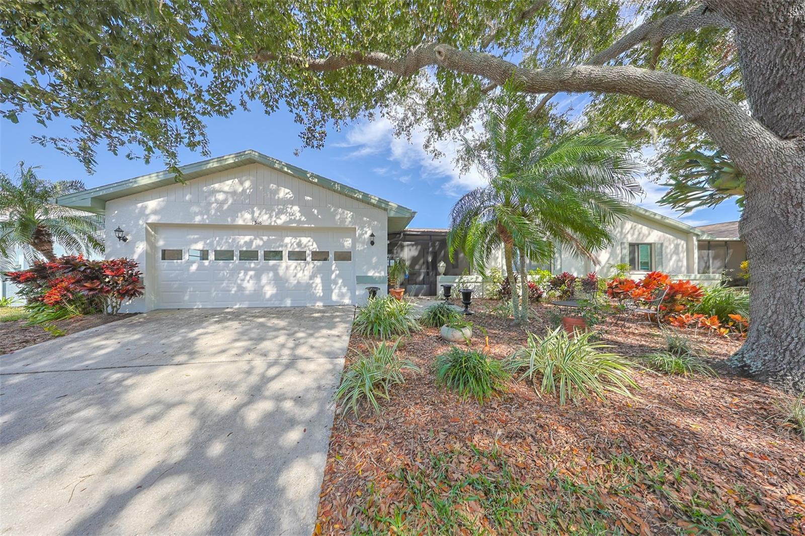 Beautifully landscaped, freshly painted exterior and a large, shaded lot with swaying Palm Trees and a large 35-year-old majestic Oak tree make for a perfect front entrance to your new home. This home is TURNKEY!