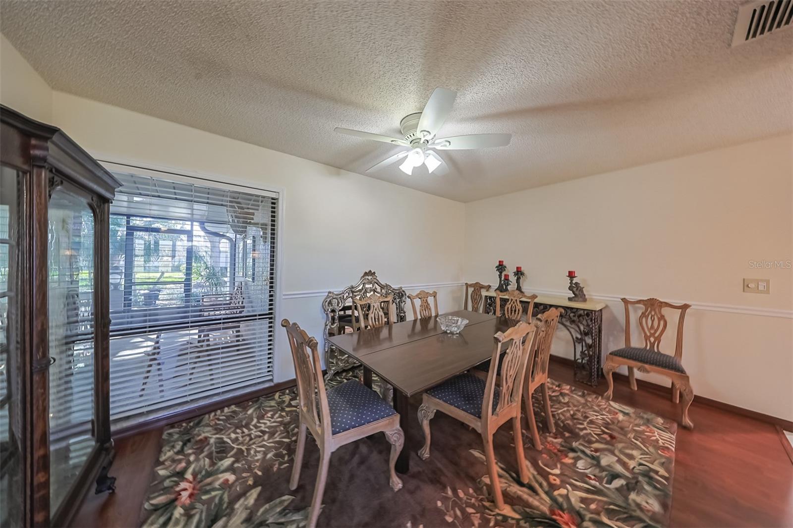 Dining room offers a cozy space for private dinners or playing cards with friends.  Easy access to the kitchen makes for perfect entertaining opportunities and includes a ceiling fan with light.