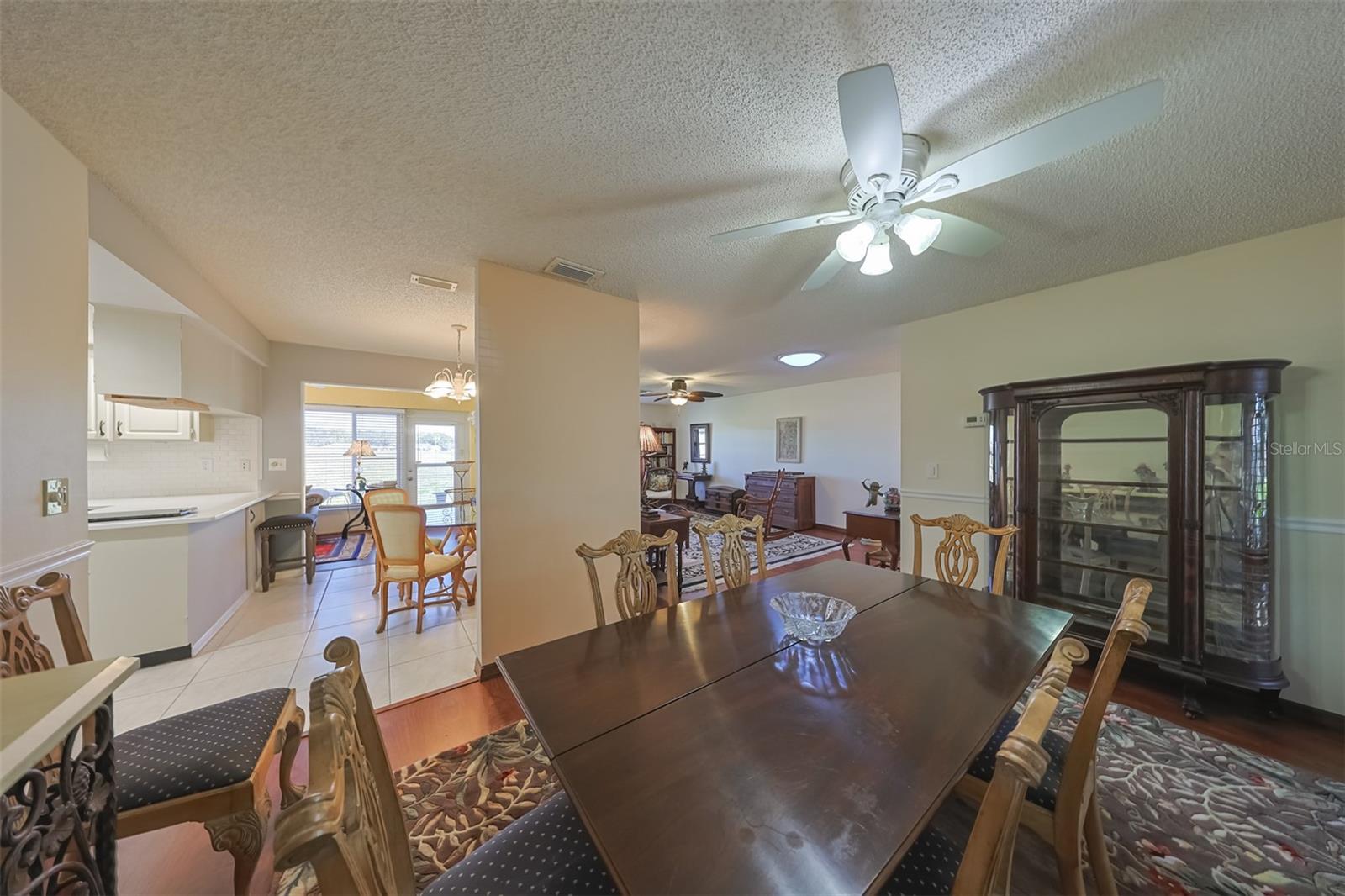 Kitchen is bright, open and spacious, with a tray ceiling, recessed lighting and a ceiling fan for comfort while cooking.  The eat-in area is convenient and even has a view of the golf course.